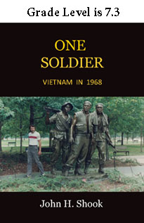 photo of John Shook beside Vietnam Memorial